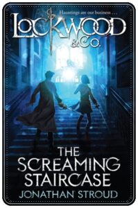 Book cover: “The Screaming Staircase” by Jonathan Stroud (Doubleday, 2013); audiobook read by Miranda Raison (Random House Audio, 2013)